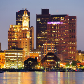 Jacksonville skyline at night over the St. Johns River with illuminated buildings