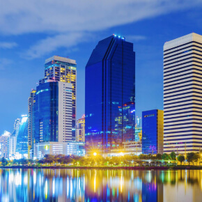 Tampa skyline at dusk reflecting over calm waterfront